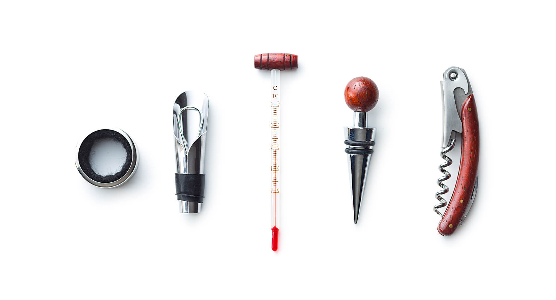 korkskruv och vintermometer på ett bord